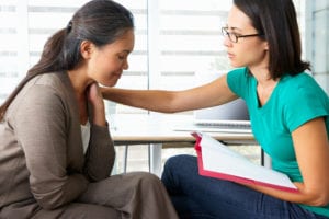 Woman Receiving Help and Support from a Case Worker