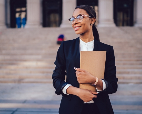 Black female lawyer outside courthouse