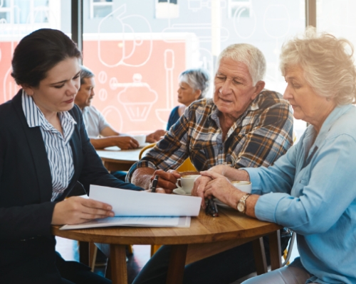 Elderly couple going over paperwork