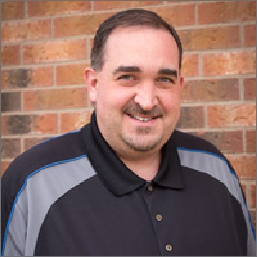 Headshot of Chris, Director of Social Enterprise